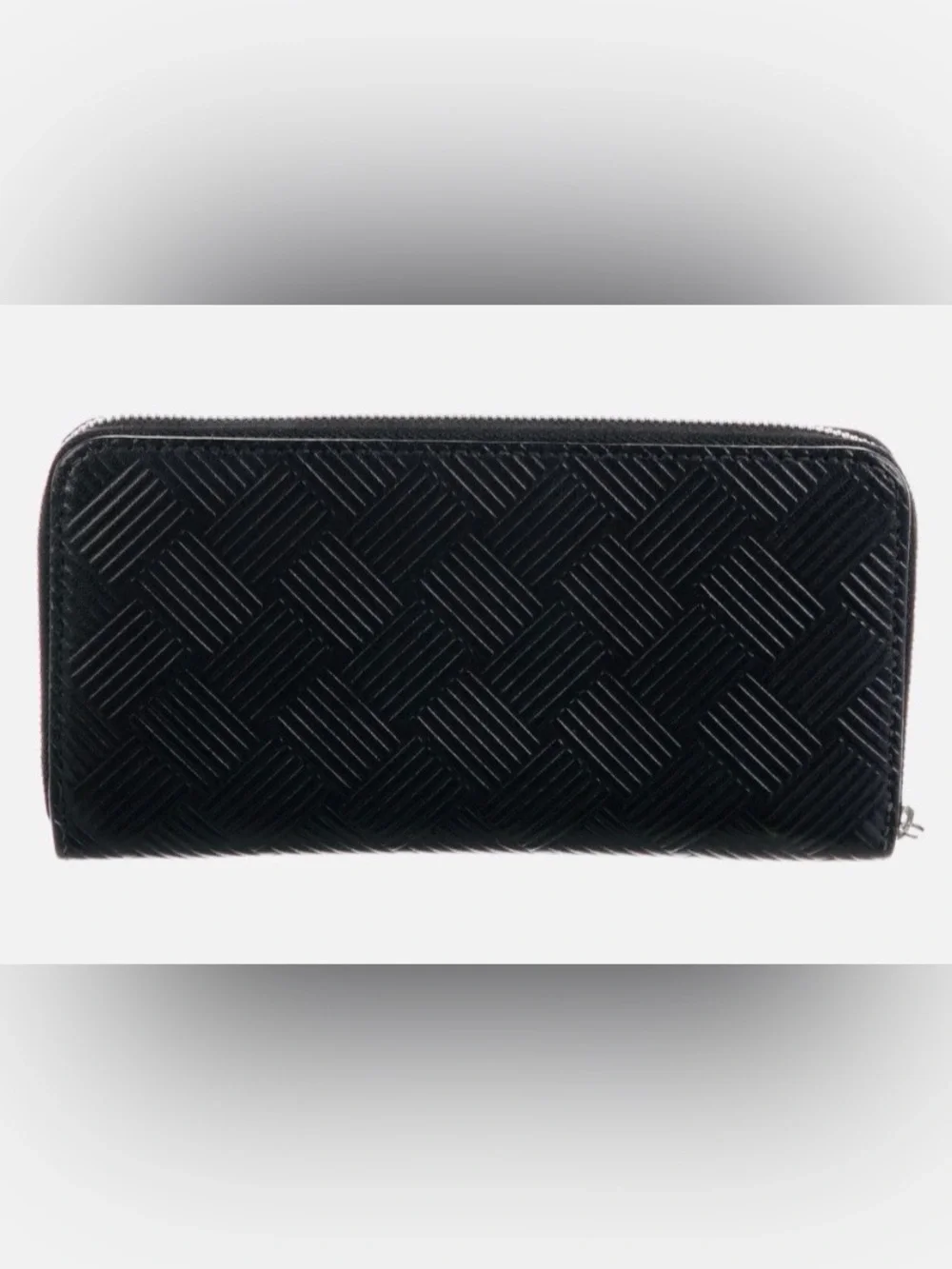 BOTTEGA VENETA Black Zip Around Wallet in Intrecciato Debossed Calfskin. UNISEX.